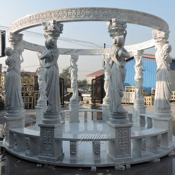 Luxury round marble gazebo with lady statues for the guests of the hotel